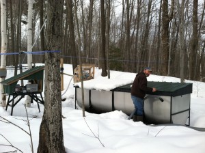 The old steel buckets with lids that had to be emptied by hand into wooden barrels on sleds drawn by horses are a thing of the past for modern-day maple syrup producers. Here John Keurulainen collects sap.