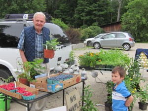 Carl Webber sells his delicious produce outside the Dublin General Store and Post Office on Saturday mornings. At lower right, Paul Simpson enjoys the spread. Be sure to stop by. Photo by Sally Shonk