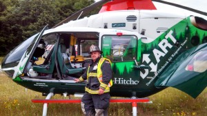 Justin Carpenter on duty by the medical helicopter at Weis Field after a recent accident.