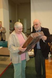 Pat Walker accepts the Citizen of the Year Award for her husband Mike, who died in 2012, from Charlie Champagne. Photo by Sally Shonk