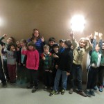 DCS kids lined up to go out on the rink to clean up after "Huck The Puck."