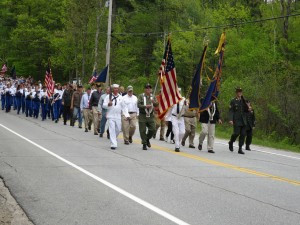 The Memorial Day Parade of 2014 progressed up Route 101 on May 26 with Band, Cadets, T-Ball troupe and townspeople following close behind en route to the cemetery to honor those who have made the greatest sacrifice of all to our country. Photo by Hal Close.