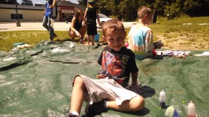 Gavin Filaski, 5 years old, tie-dying T-shirts at Summer Playground. Photo by Sally Shonk
