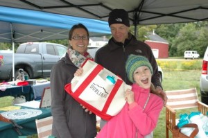 Rebecca, Jeff, Gabrielle Oja selling tote bags and water bottles for the Women's Club Beach restoration. Jud and Sally Hale with Linda Clukay (center) testing potholders at the Dublin Craft Fair. Winnie Sundstrom selling her framed photographs and cards. All photos by Sally Shonk