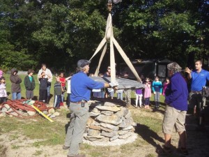 John Kaufhold and Nick set the Goshen Stone on the outdoor oven at DCS.