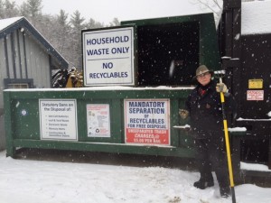 Tom Kennedy stands at the ready outside the compactor at the Dublin Recycling Center. Photo by Margaret Gurney