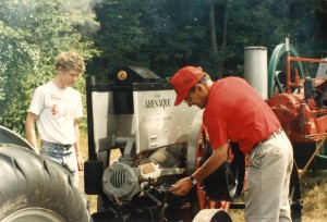 As his son Peter looks on, Bob is shown here fiddling with his Abenaque engine at a Dublin Engine Show. Taken in the early 1990s.