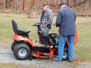 Cles Staples and Michael Edick inspecting the new cemetery tractor shortly after it arrived in Dublin April 7. Photo by Hank Campbell.