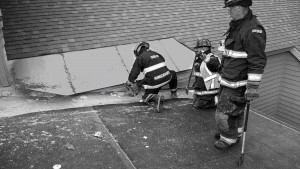 As a special part of their regular training exercises, the Dublin Volunteer Fire Department was able to practice roof ventilation techniques on a commercial building at the Dublin School in mid-June. A building was scheduled for demolition on the following day, allowing the firefighters to practice cutting holes through the roof. A new David E. Howe Administration Building will be completed by late fall. Firefighters: Andy Hungerford, Justin Carpenter and Andy Freeman is standing. Photo by Joe Sangermano 